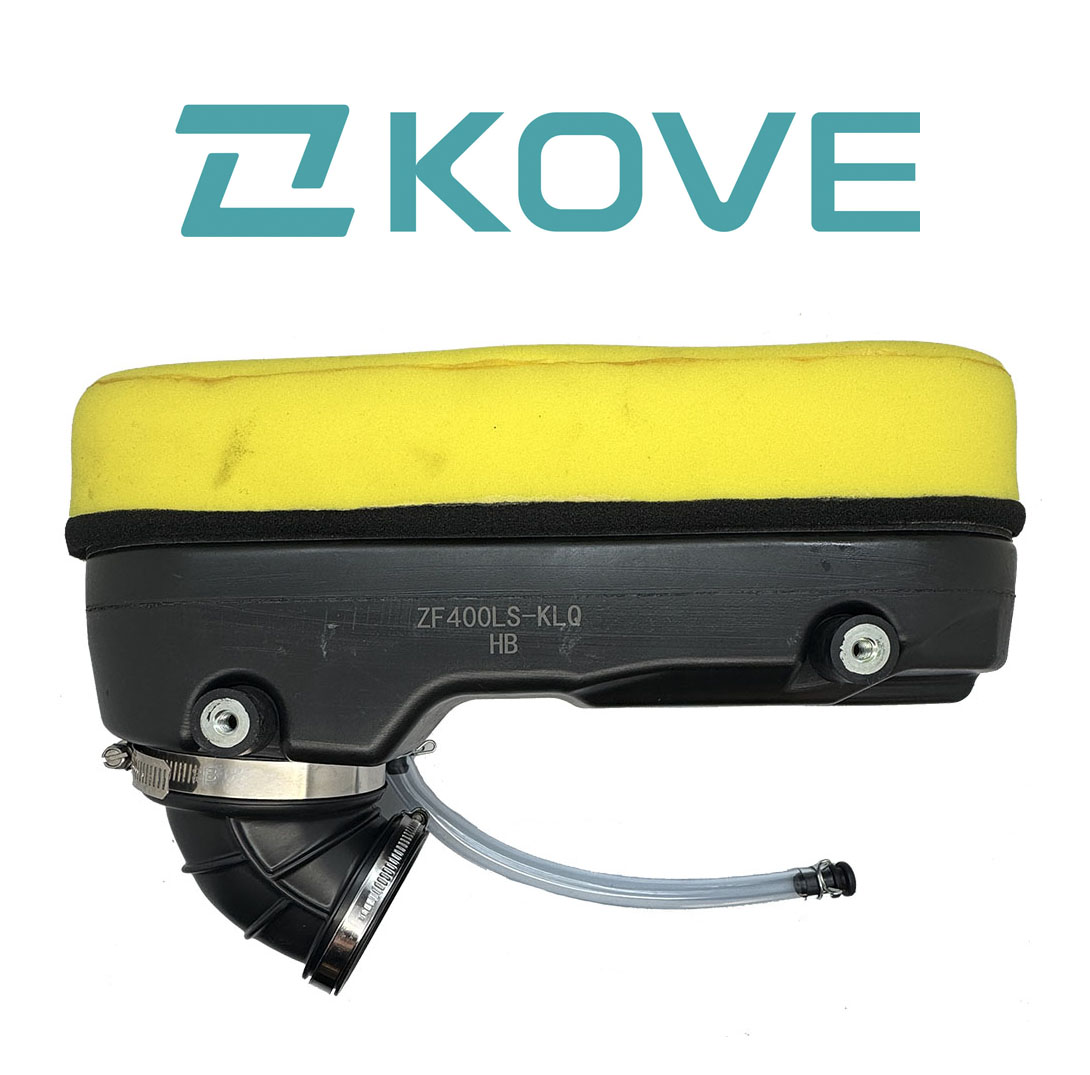 yellow foam air filter mounted onto full black plastic airbox with drain tube