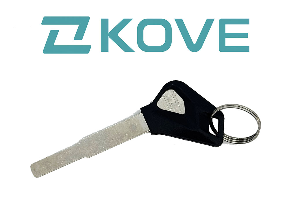 a motorcycle key with black handle sitting under the KOVE brand logo