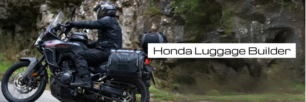A motorcyclist in black gear riding a Honda motorcycle equipped with luggage, set against a rocky outdoor background.